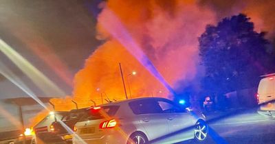 Portadown fire: Firefighters remain at scene near M1 as public urged to stay away