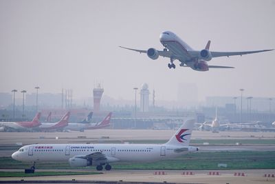 China shortens suspensions for international flights linked to COVID cases