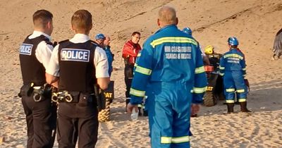 Boy 'up to his neck in water' rescued in Formby beach drama