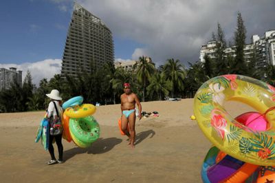Over 80,000 tourists trapped in 'China's Hawaii' after Covid outbreak