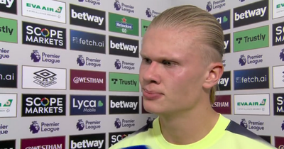 Erling Haaland reacts after scoring his first two goals for Man City