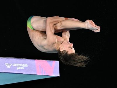 Rousseau's dive of his life leads to gold