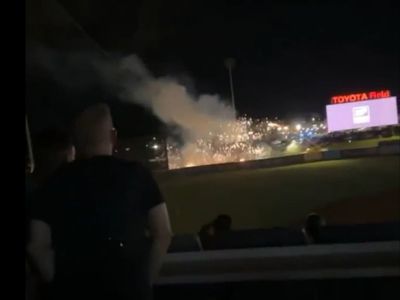 Dramatic video shows crowds running for safety as fireworks malfunction at baseball game