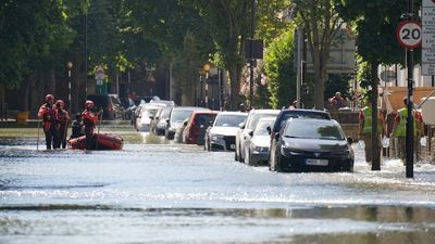 Roads closed as burst water main causes four feet deep flooding