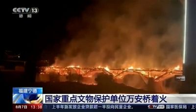Fire engulfs historic wooden bridge in southern China