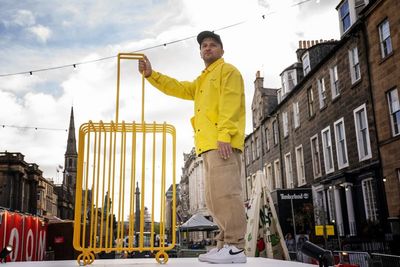 Artist unveils suitcase sculpture to highlight plight of refugees