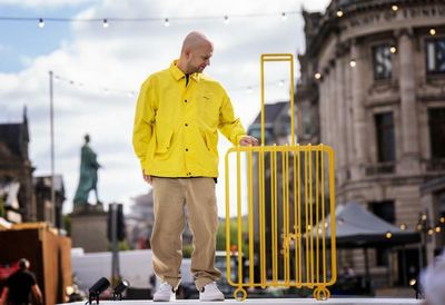 Artist who fled Russia reveals suitcase sculpture highlighting plight of refugees