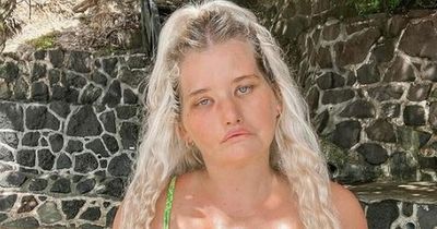 Woman who 'can't smile' defies bullies as she finds self-confidence and becomes a model