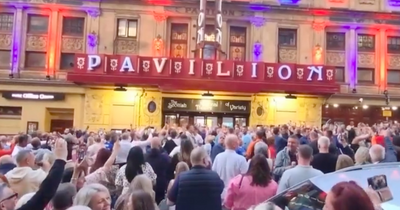 Rangers fans erupt into rousing song outside Glasgow theatre after show paused during fire drill