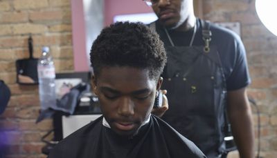 Back-to-school haircuts offered by South Side nonprofit get students ready to return to class