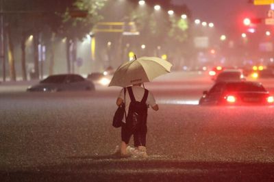 Record rain leaves at least 7 dead in Seoul