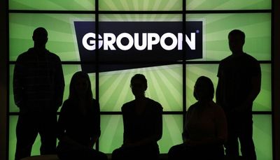 Groupon plans 500 layoffs as its losses widen