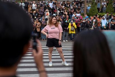 At a Jakarta crosswalk, Indonesian teens take to the catwalk