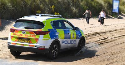 Police searching for 'missing' woman on Merseyside beach