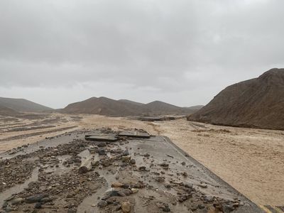 A key route in Death Valley buried in floods will be closed for another week