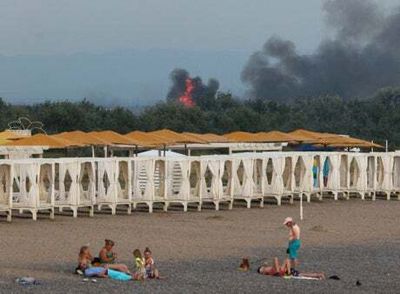 Beachgoers watch explosions at Russian military airfield in Crimea