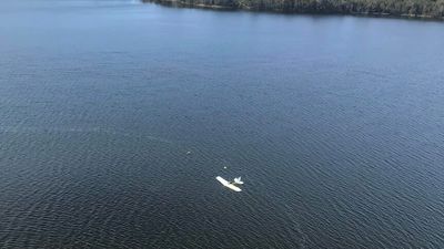 Men winched to safety after seaplane crashes into a lake near Moruya, southern NSW