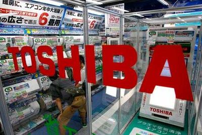 Troubled Toshiba’s profits chipped by raw materials hike