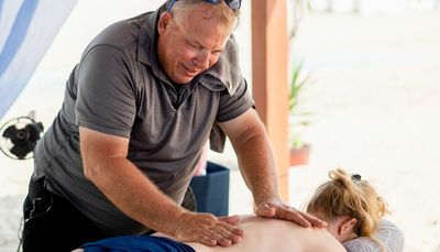 How a truck driver turned massage therapist became a legend at Oak Street Beach