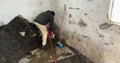 Family's home ruined after sinkhole with 'fetid odour' leaves massive hole in floor