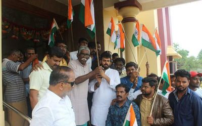 Congress members hand over tricolour to RSS functionaries