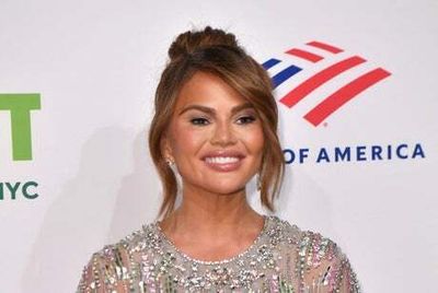 Chrissy Teigen shows off baby bump during acupuncture session just days after announcing pregnancy