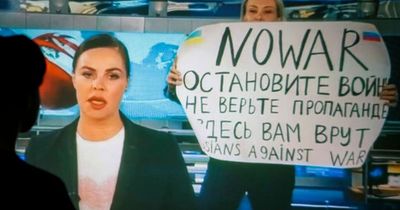 Woman who stormed Vladimir Putin's news show with 'stop the war' banner has home RAIDED