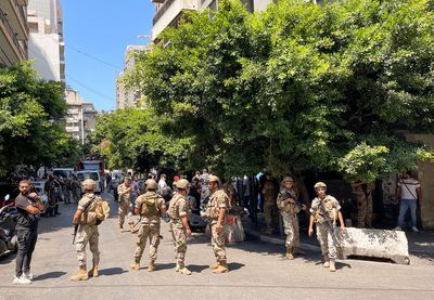 Armed man demanding frozen deposits takes hostages at Lebanese commercial bank