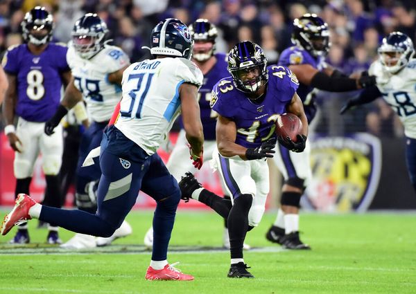 Tennessee Titans wide receiver Terry Godwin (80) runs the ball against Baltimore  Ravens linebacker Diego Fagot (48) during the second half of a NFL  preseason football game, Thursday, Aug 11, 2022, in