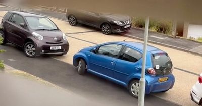Woman fumes at 'pathetic' neighbours for two-car system to save roadside parking space