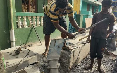 Contractor arrested for laying concrete drain without removing hand pump in Vellore