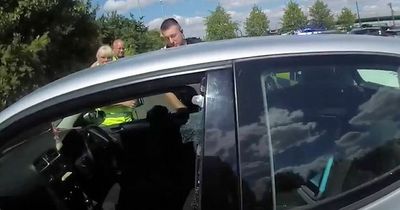 Moment dog is rescued from car in 30 degree heat is captured on police bodycam