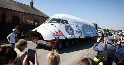 Crowds gather to witness a piece of British aviation history settle into its new home in Salford
