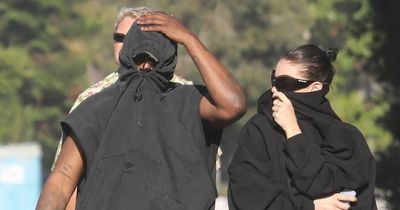 Kanye West fails to keep low profile with mystery brunette on Malibu home visit