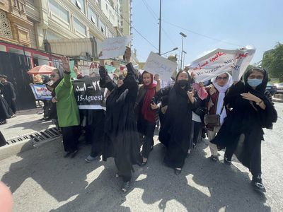 Women march in a rare protest in Kabul's streets — and face violence from the Taliban