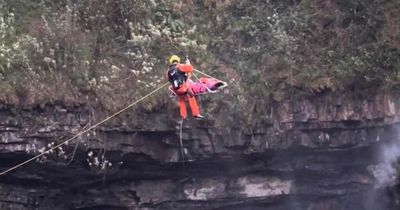 Man suffers suspected broken legs and spinal injuries after waterfall jump