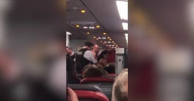 Dad tackles woman who stripped to underwear and tried to storm cockpit on Jet2 flight