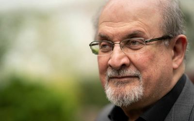 Salman Rushdie awake and still ‘feisty’, family says