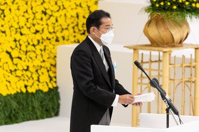 Japan PM vows no more war; ministers visit shrine to war dead