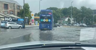 UK weather: Roads underwater as floods lash Britain after scorching heatwave