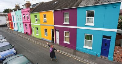 Mini property boom as artist overhauls drab houses to create 'rainbow roads'