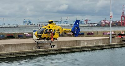 Emergency services rush to New Brighton waterfront as air ambulance lands