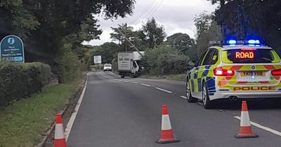 Road closed after van drives into telegraph pole