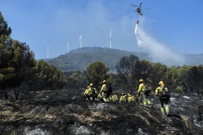 Spain, Portugal battle to control huge wildfires