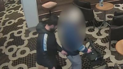 CCTV captures moment thief pickpockets elderly man with walking frame in Melbourne RSL