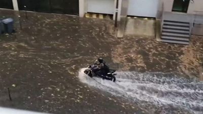 Paris mops up as heavy rain and flash floods bring transport to a halt