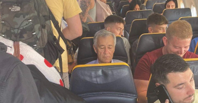 Hibs owner Ron Gordon pictured on a flight full of Switzerland-bound Hearts fans