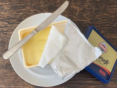 One block of butter, three lids: Fonterra defends impact of packaging