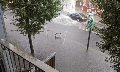 UK weather: storms and flash floods hit southern England