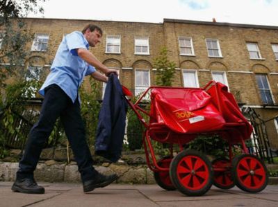 Royal Mail workers vote 98% in favour of strikes in row over terms and conditions